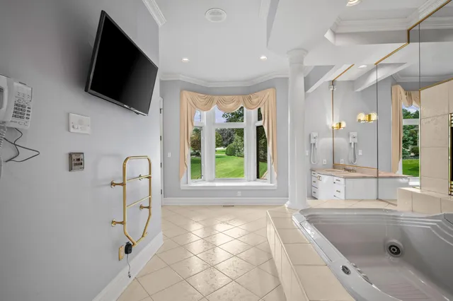 an aerial view of a house with a lake view