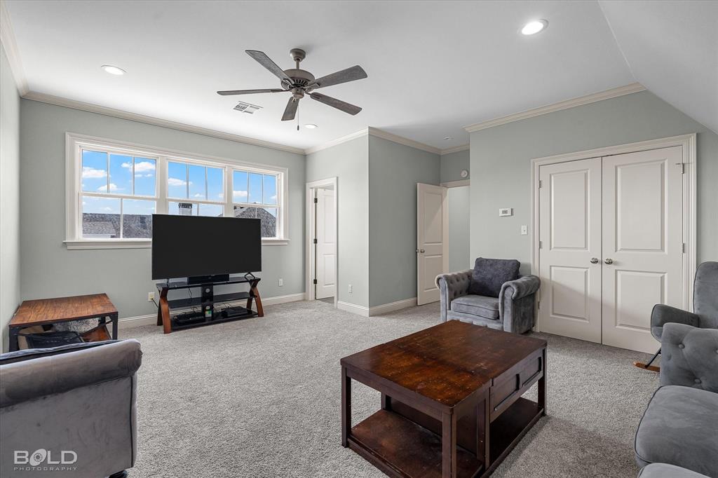 143 Oak Alley Road Stonewall, LA 71078 - Photo 31 of 38 Room featuring a ceiling fan, recessed lighting, multiple windows, and light gray wall paint