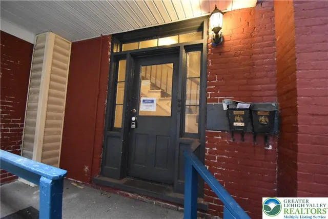 a bathroom with a shower and a sink