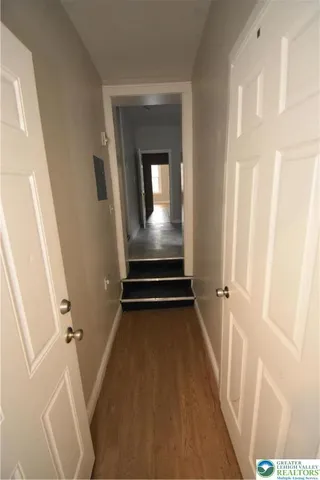a white toilet sitting next to a bathroom sink and a window