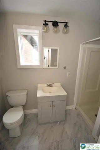 a kitchen with a refrigerator stove and wooden cabinets