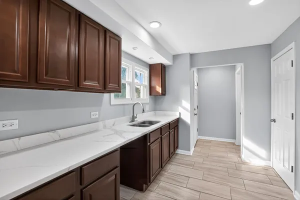 a kitchen with a sink and cabinets