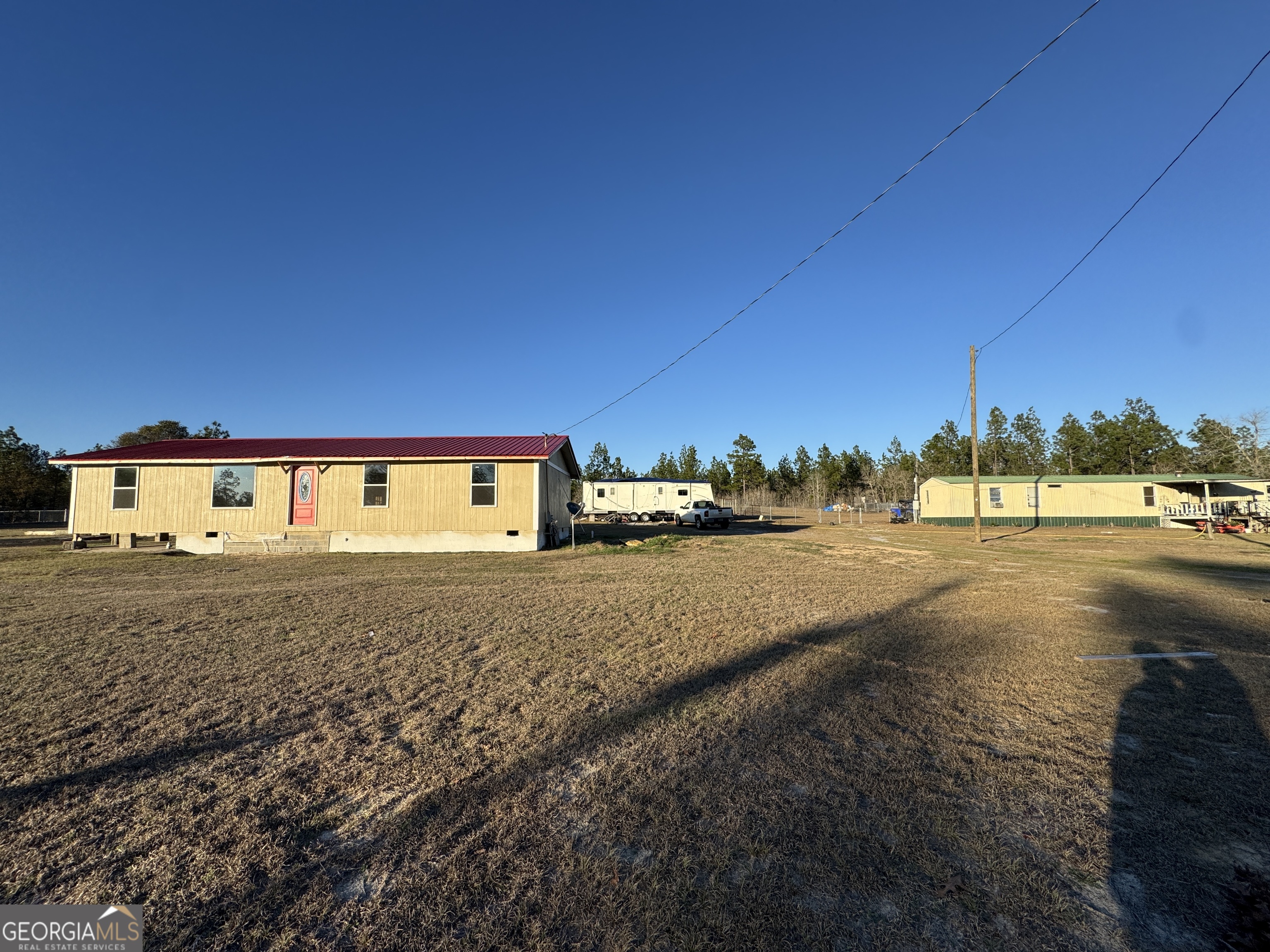 1249 Lambs Bridge Road Twin City, GA 30471 - Photo 2 of 14 a view of a street with houses