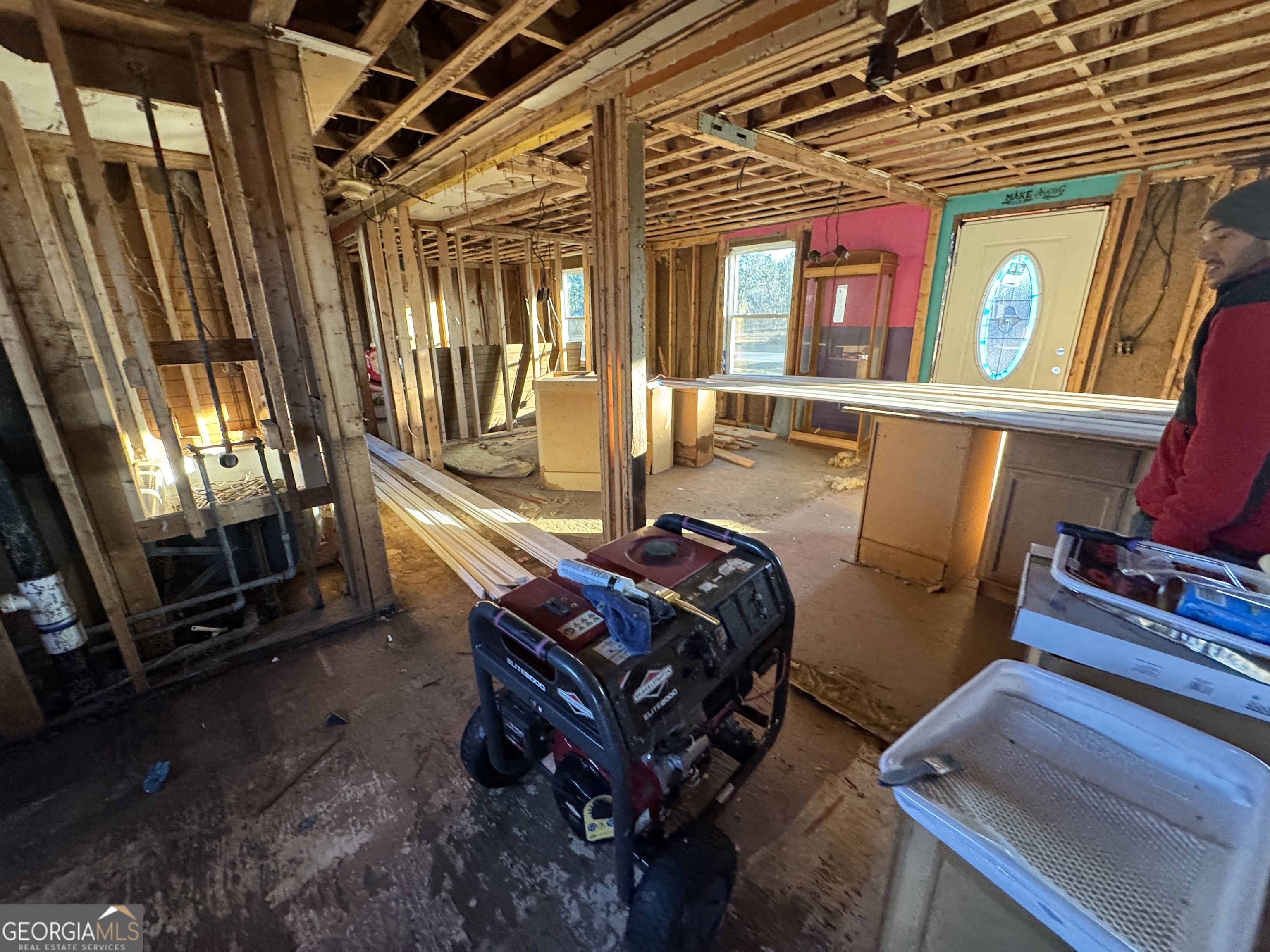 1249 Lambs Bridge Road Twin City, GA 30471 - Photo 4 of 14 a room with furniture gym equipment and a flat screen tv