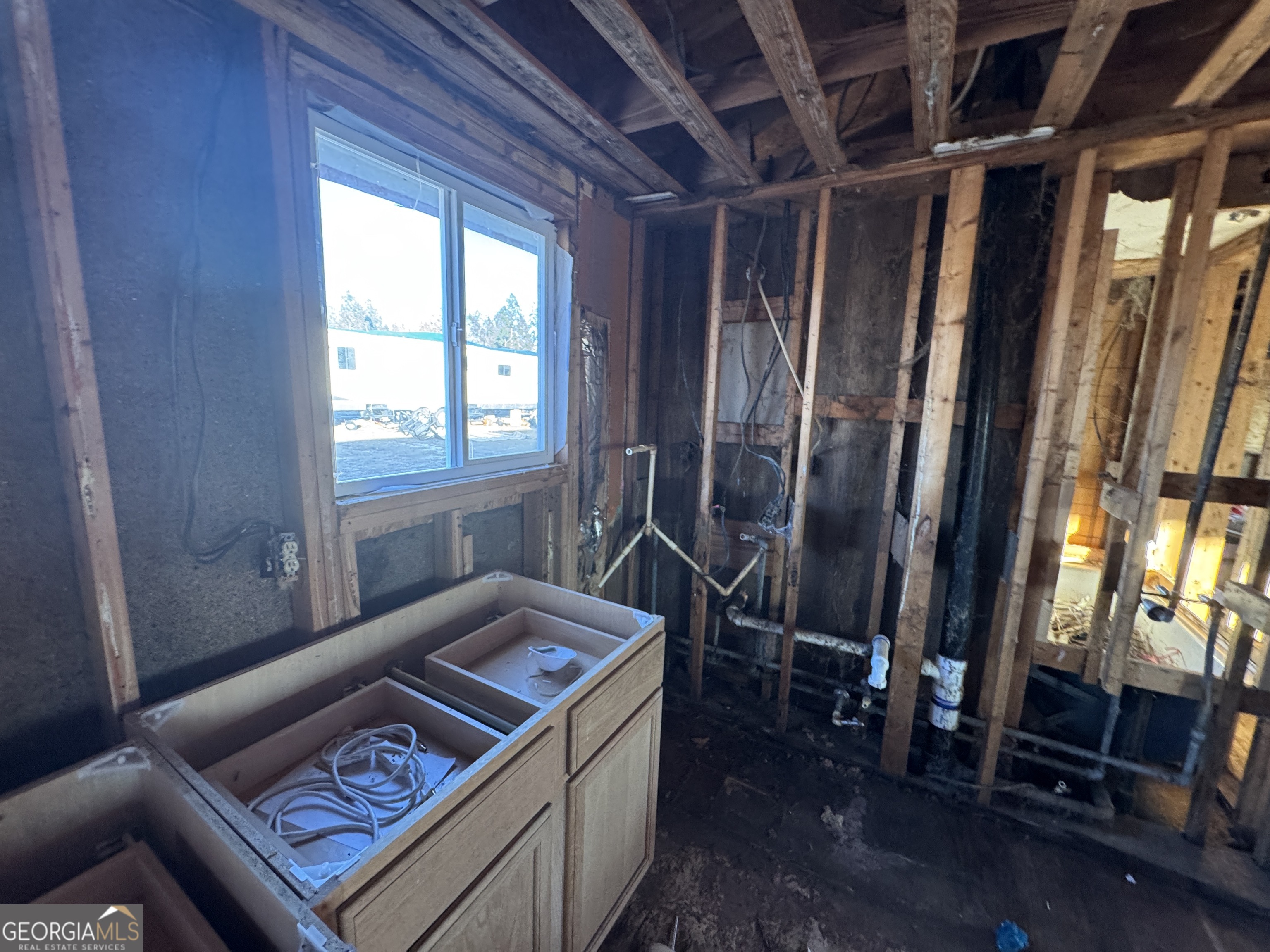 1249 Lambs Bridge Road Twin City, GA 30471 - Photo 5 of 14 a room with furniture and a window