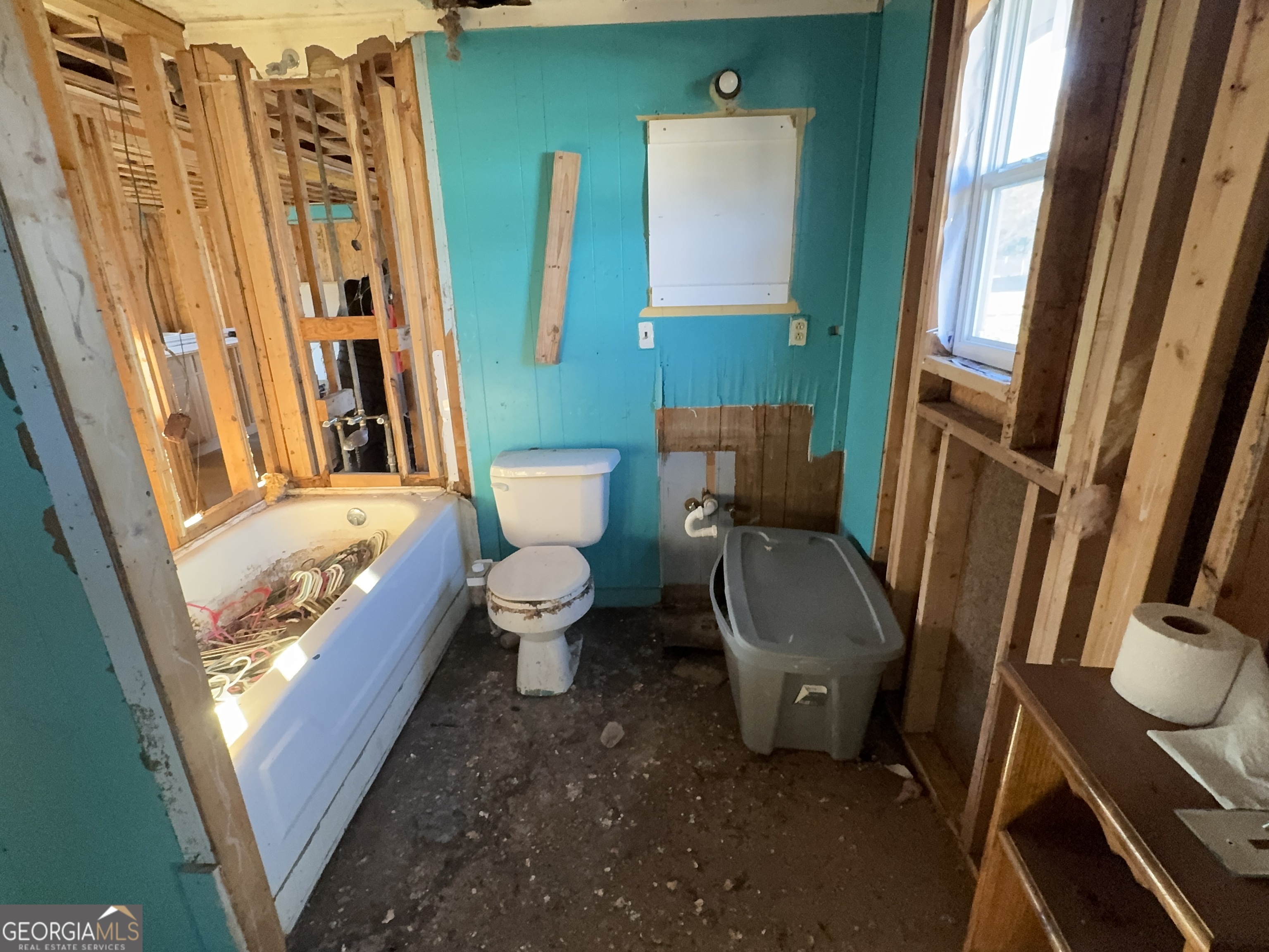 1249 Lambs Bridge Road Twin City, GA 30471 - Photo 9 of 14 a bathroom with a toilet sink and mirror