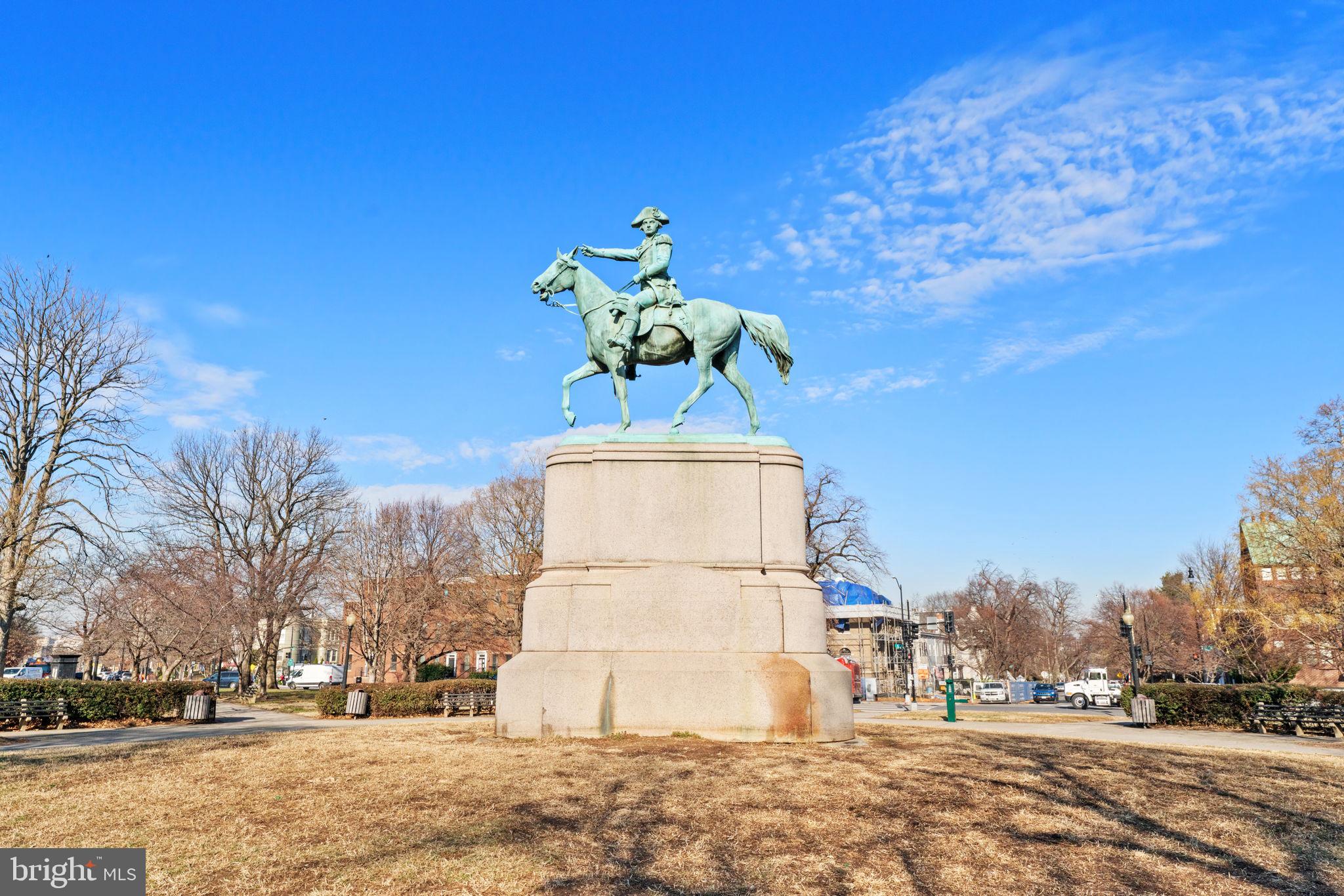 644 Massachusetts Avenue Northeast, Unit 406 Washington, DC 20002 - Photo 31 of 31 a vase of flowers sitting on a sidewalk