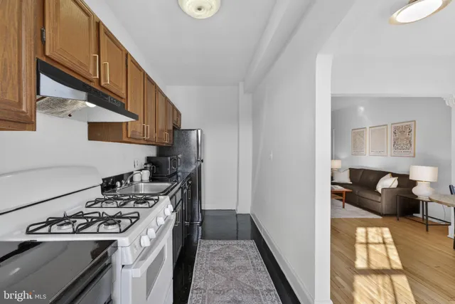 a kitchen with a stove and a refrigerator