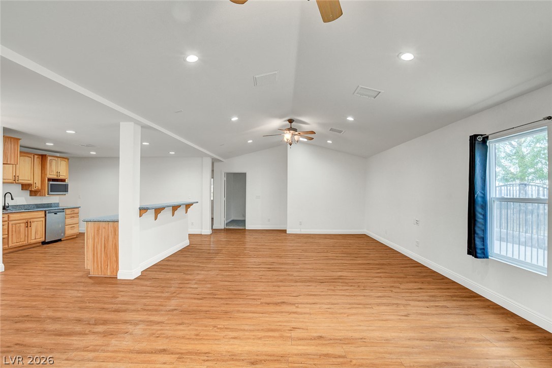 1810 Pinto Road Henderson, NV 89002 - Photo 15 of 53 An inviting open-concept living area with vaulted ceilings and abundant natural light.