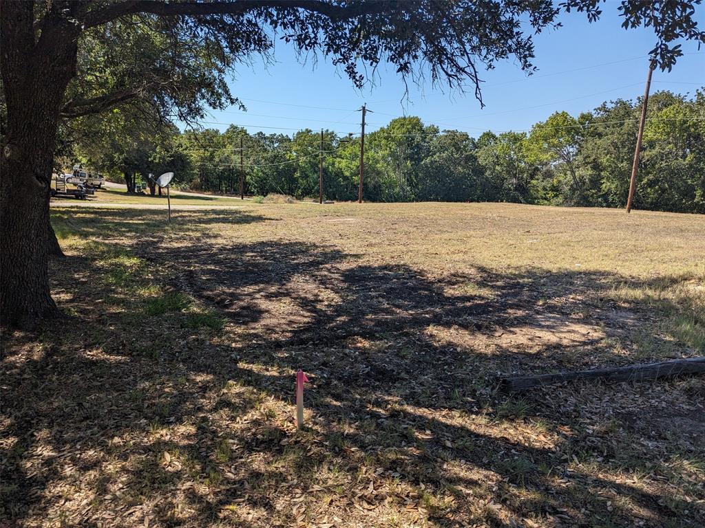Tbd Unit 6 Runaway Bay, TX 76426 - Photo 4 of 12 a view of a field with a tree