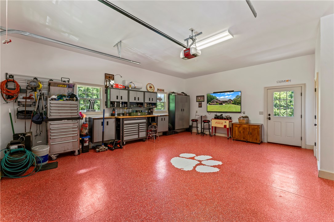 579 Terrapin Crossing Road Pickens, SC 29671 - Photo 31 of 50 A vibrant, durable epoxy floor with a paw print emblem defines this well-appointed garage/workshop space
