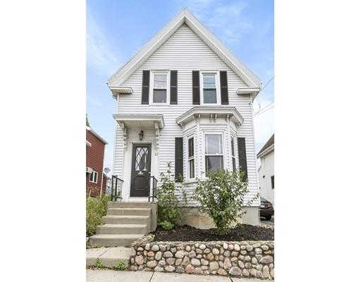 22 Spring Street Everett, MA 02149 - Photo 12 of 13 a view of a brick house with large windows