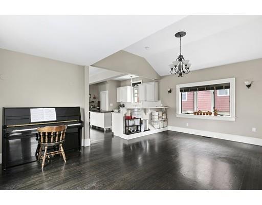 22 Spring Street Everett, MA 02149 - Photo 3 of 13 a living room with dining room and wooden floor