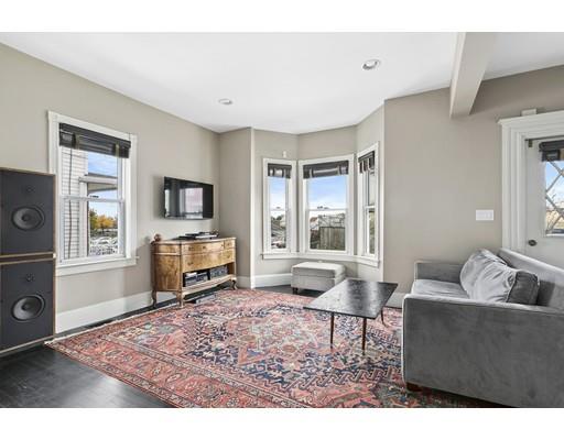 22 Spring Street Everett, MA 02149 - Photo 4 of 13 a living room with furniture and a flat screen tv
