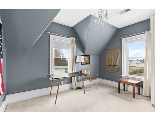 22 Spring Street Everett, MA 02149 - Photo 5 of 13 a living room with furniture and a large window