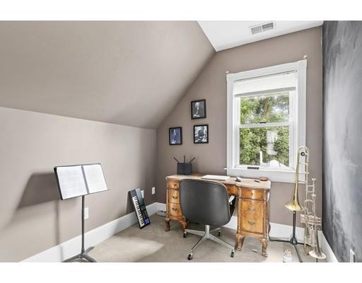 22 Spring Street Everett, MA 02149 - Photo 6 of 13 a workspace with furniture and a window