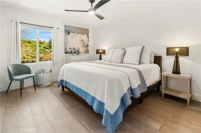 a bedroom with a bed and a chair