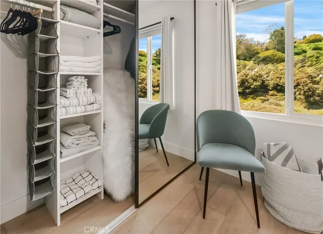 a dining room with furniture and a window
