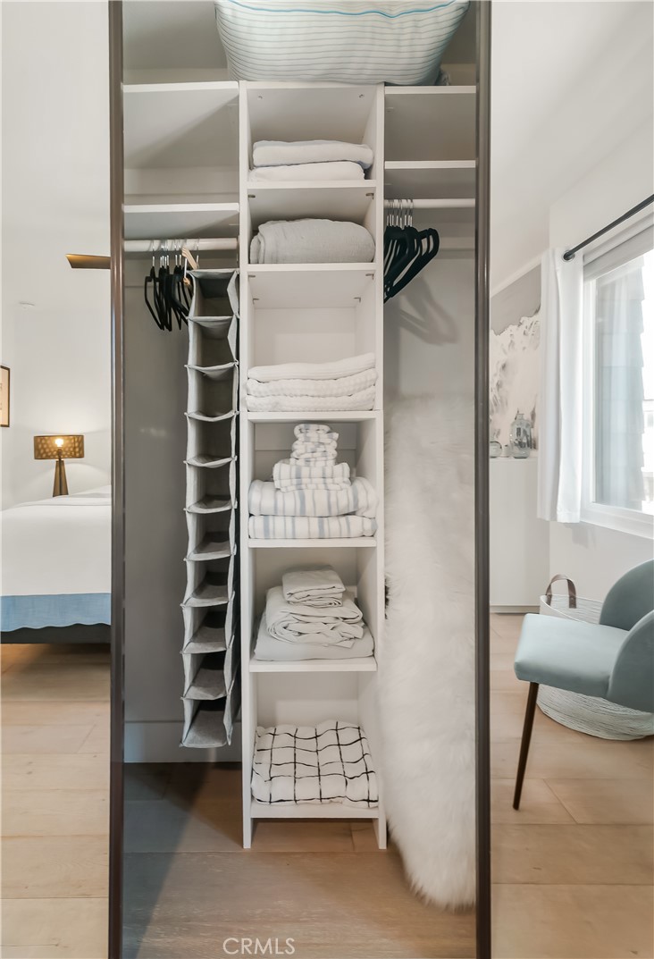 33852 Del Obispo Street, Unit 2 Dana Point, CA 92629 - Photo 16 of 30 a view of walk in closet with clothes and shoes