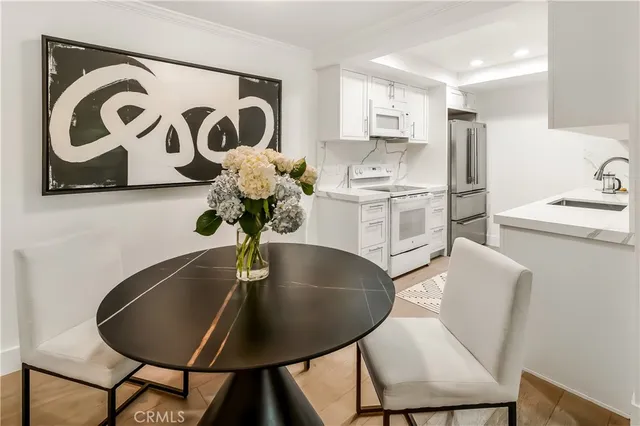 a kitchen with a table and chairs
