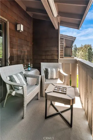 a outdoor space with a couch and a fireplace