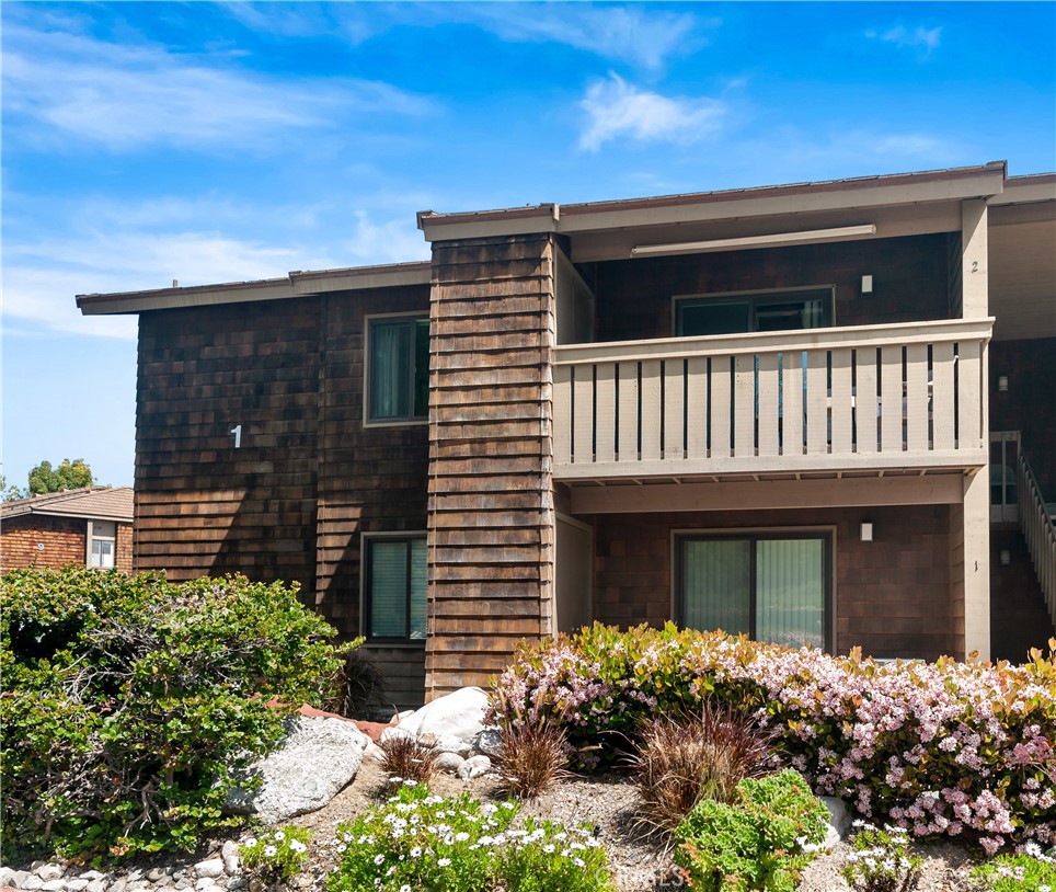 33852 Del Obispo Street, Unit 2 Dana Point, CA 92629 - Photo 22 of 30 a front view of a house with a yard