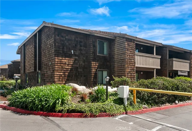 a view of a house with a street