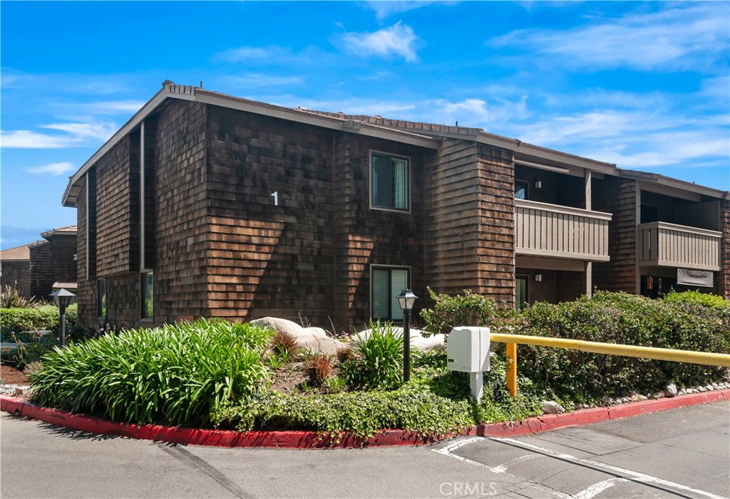 33852 Del Obispo Street, Unit 2 Dana Point, CA 92629 - Photo 23 of 30 a view of a house with a street