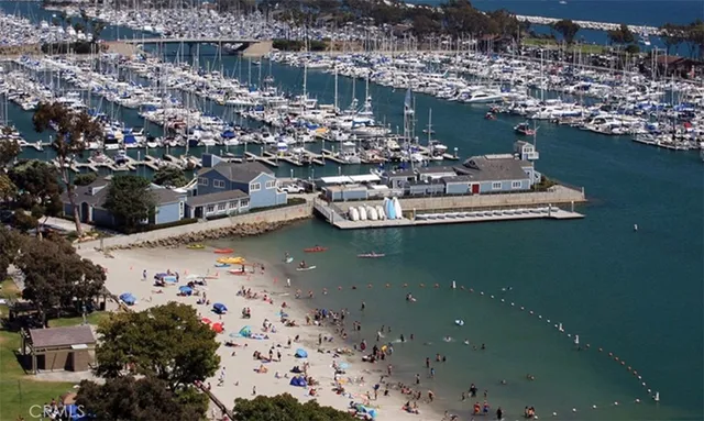 an aerial view of a houses with ocean view