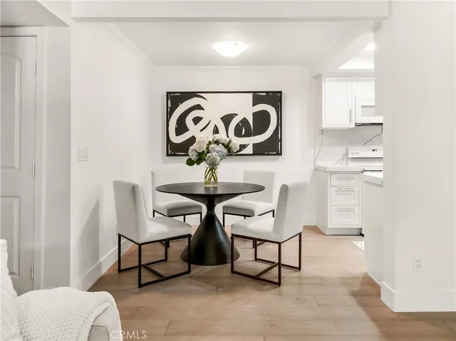 a view of a room with chairs and a table