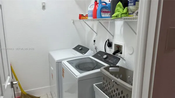 a utility room with dryer and washer