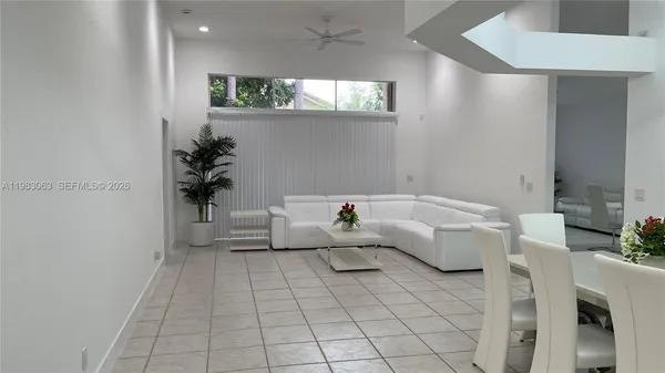 a living room with furniture and a window