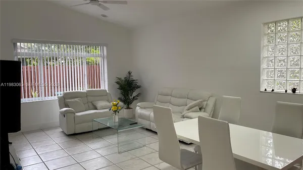 a living room with furniture and a window