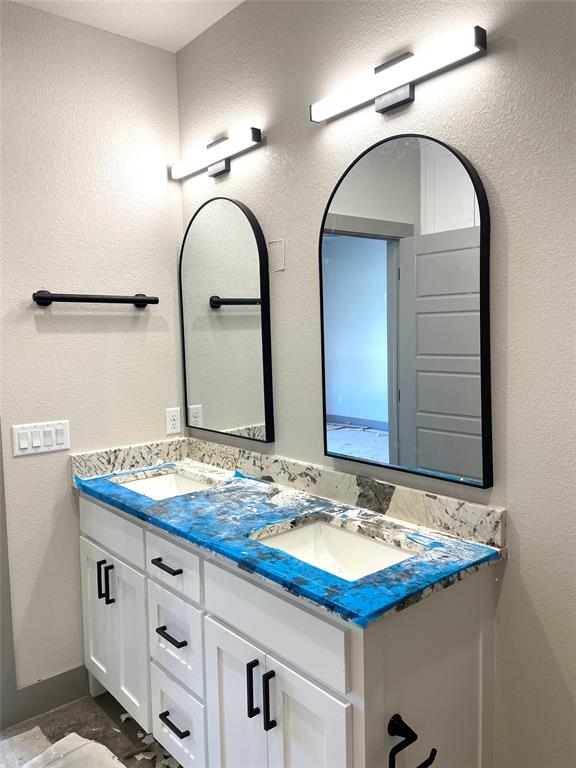 159 Lake Valley Road Sunset, TX 76270 - Photo 17 of 34 Double vanity and mirrors, work in progress