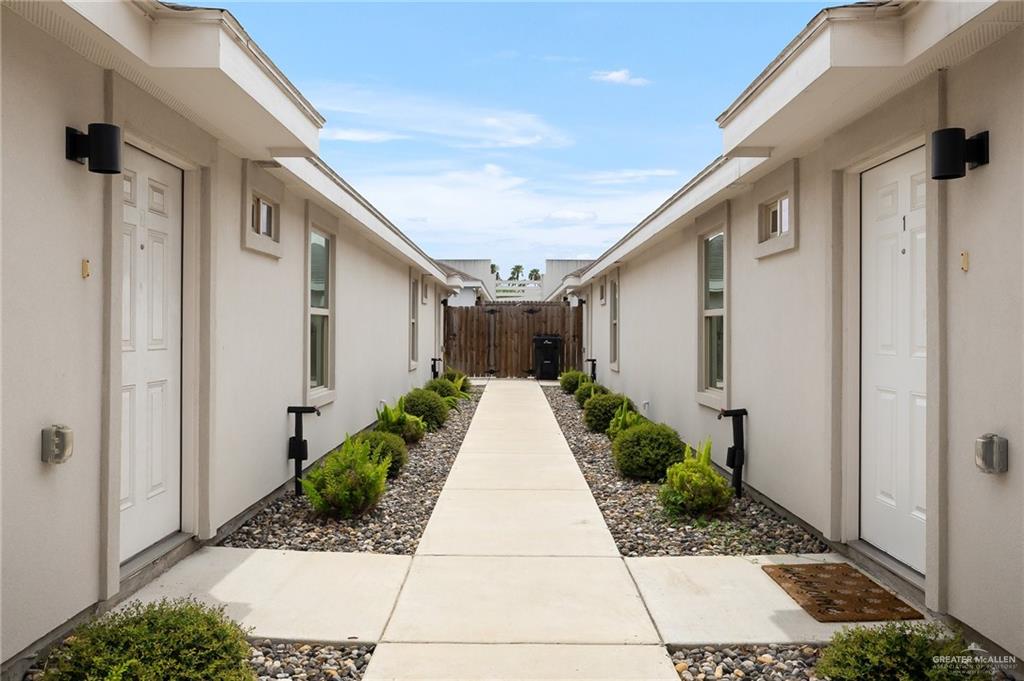 1305 Alta Vista Drive, Unit 4 Weslaco, TX 78596 - Photo 2 of 13 View of property exterior featuring stucco siding