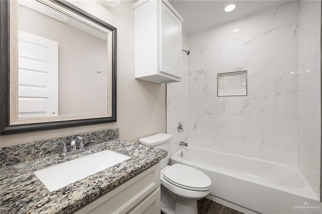 1305 Alta Vista Drive, Unit 4 Weslaco, TX 78596 - Photo 8 of 13 Full bathroom featuring washtub / shower combination, vanity, and recessed lighting