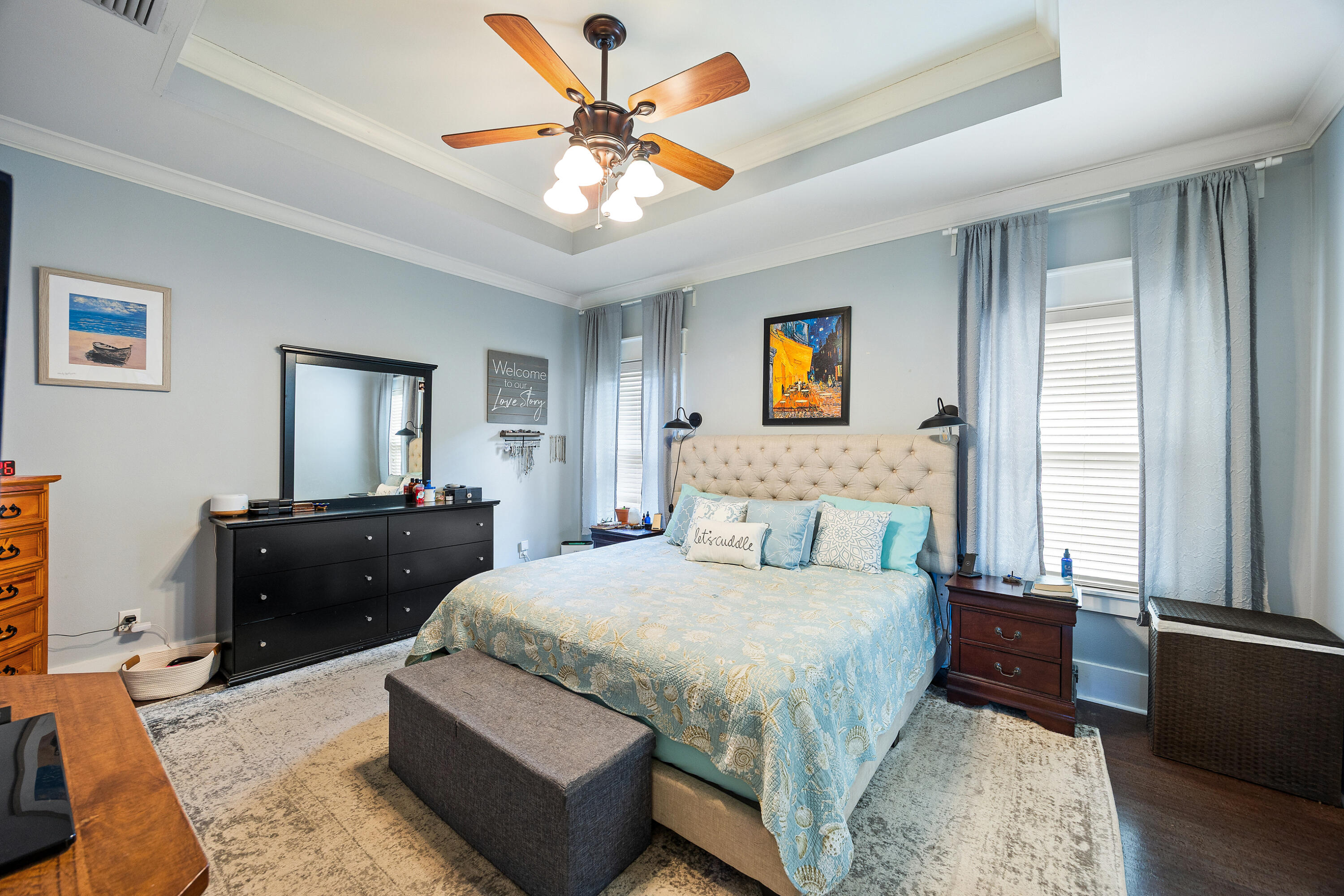 804 Symphony Way Freeport, FL 32439 - Photo 14 of 34 a bedroom with a bed and a chandelier