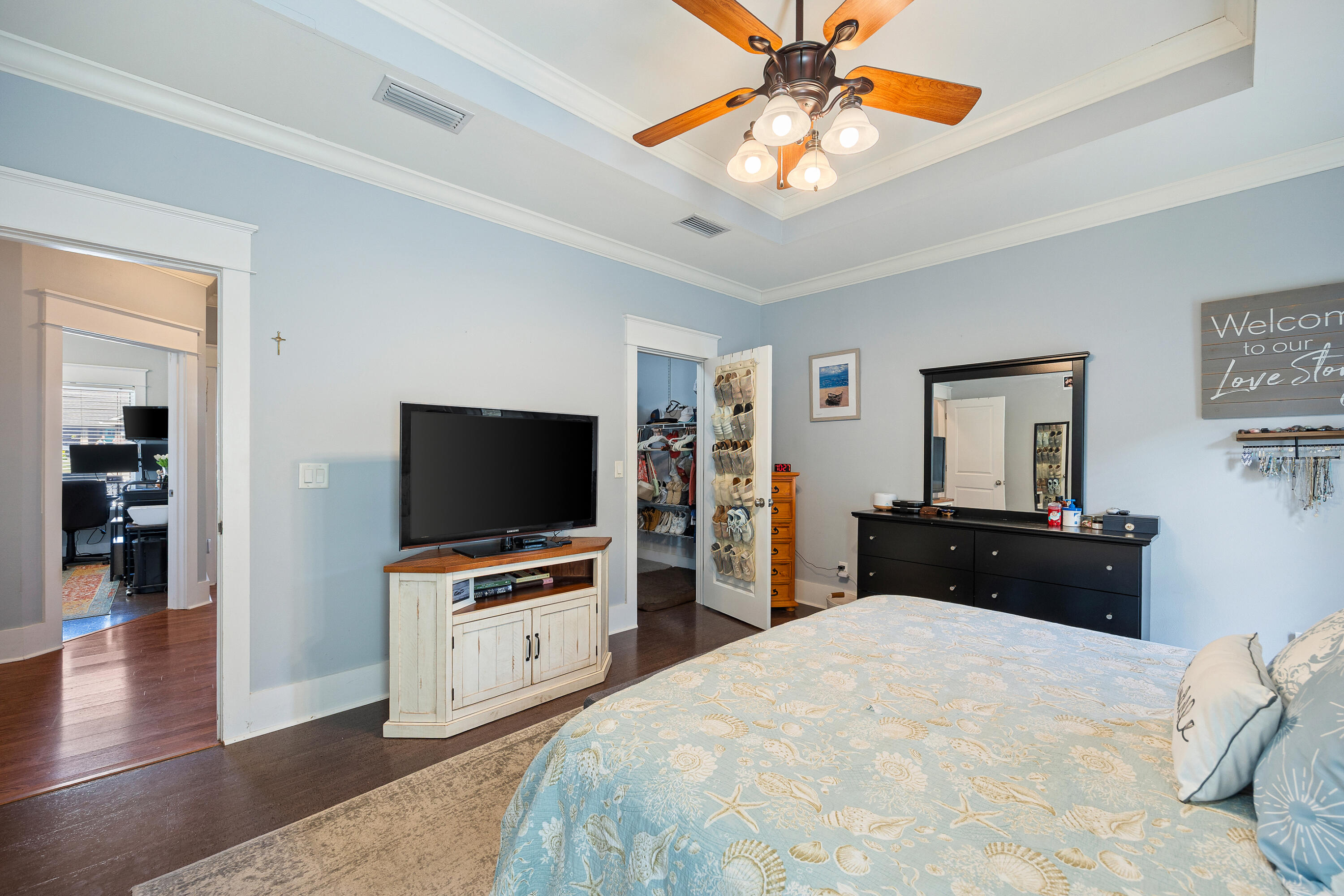 804 Symphony Way Freeport, FL 32439 - Photo 15 of 34 a bedroom with a bed and a flat screen tv
