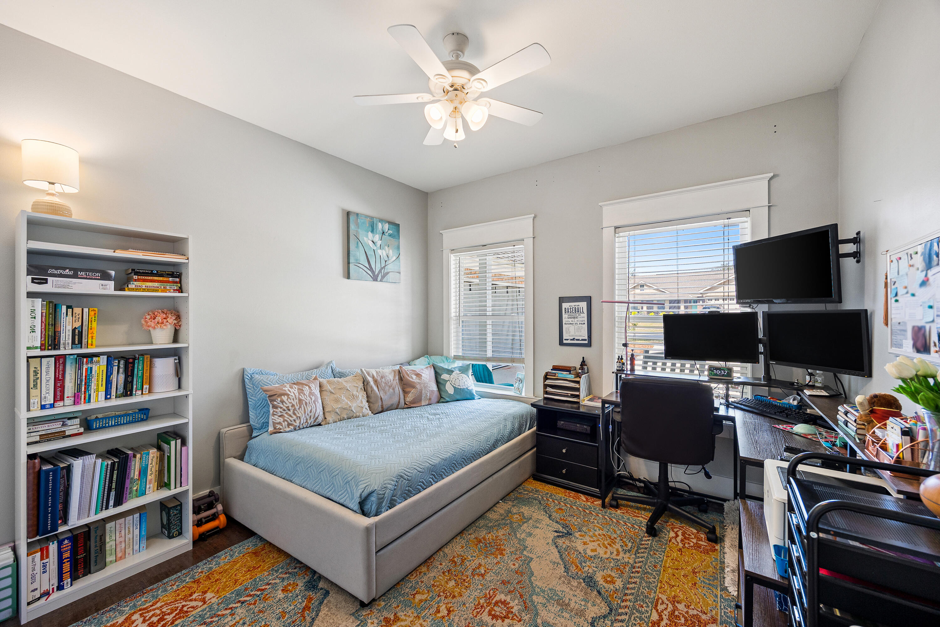804 Symphony Way Freeport, FL 32439 - Photo 20 of 34 a bedroom with a bed and a book shelf
