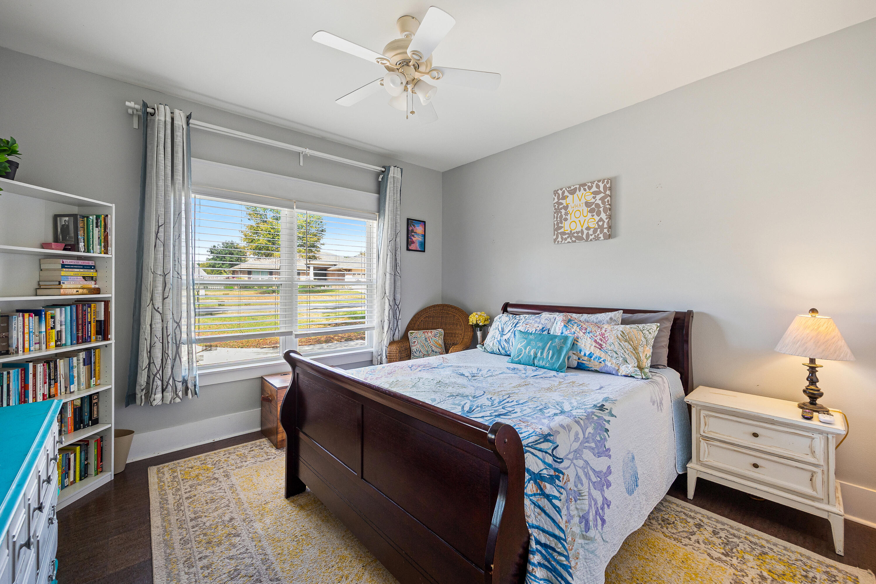 804 Symphony Way Freeport, FL 32439 - Photo 23 of 34 a bed room with a bed and a book shelf