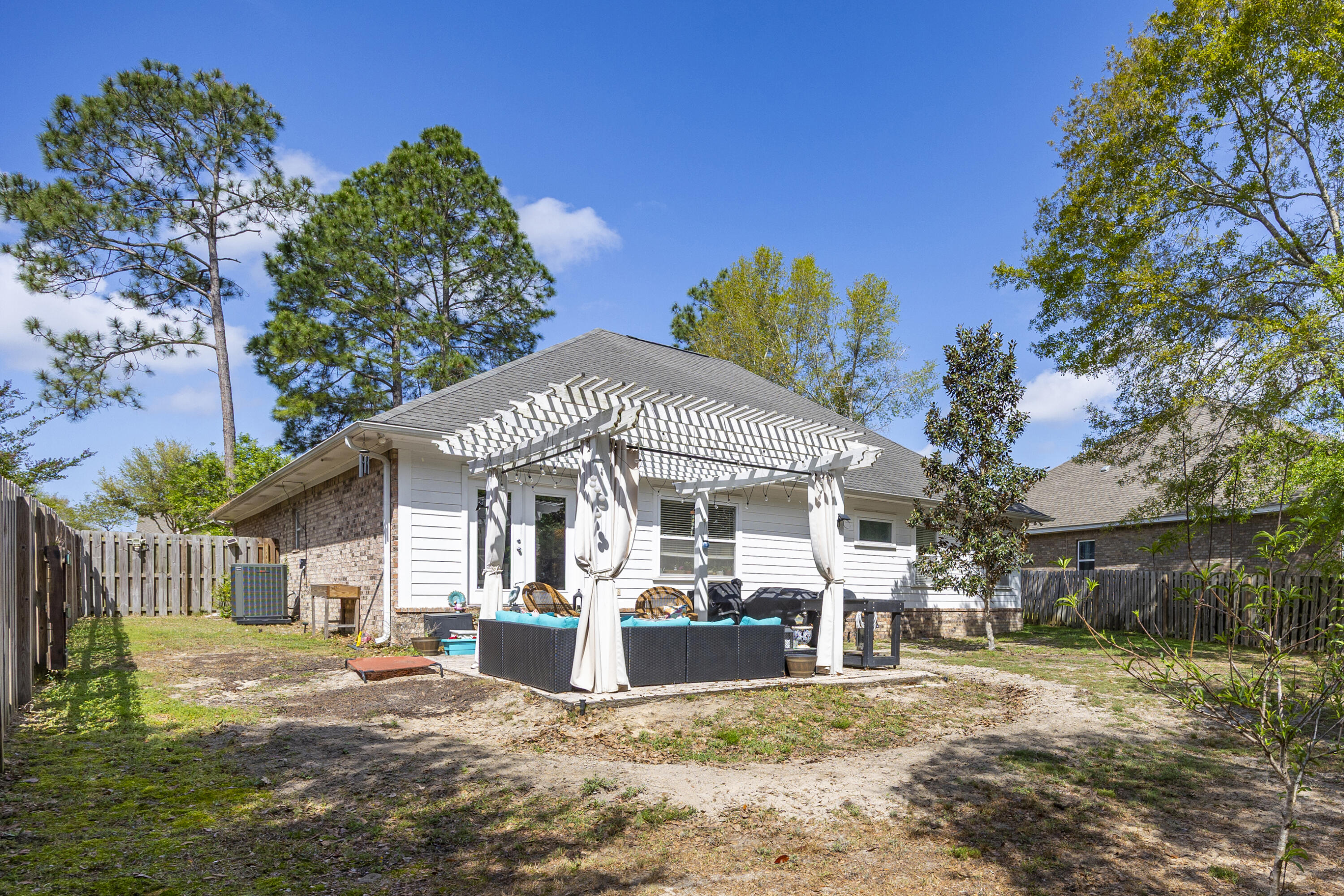 804 Symphony Way Freeport, FL 32439 - Photo 29 of 34 a front view of a house with garden