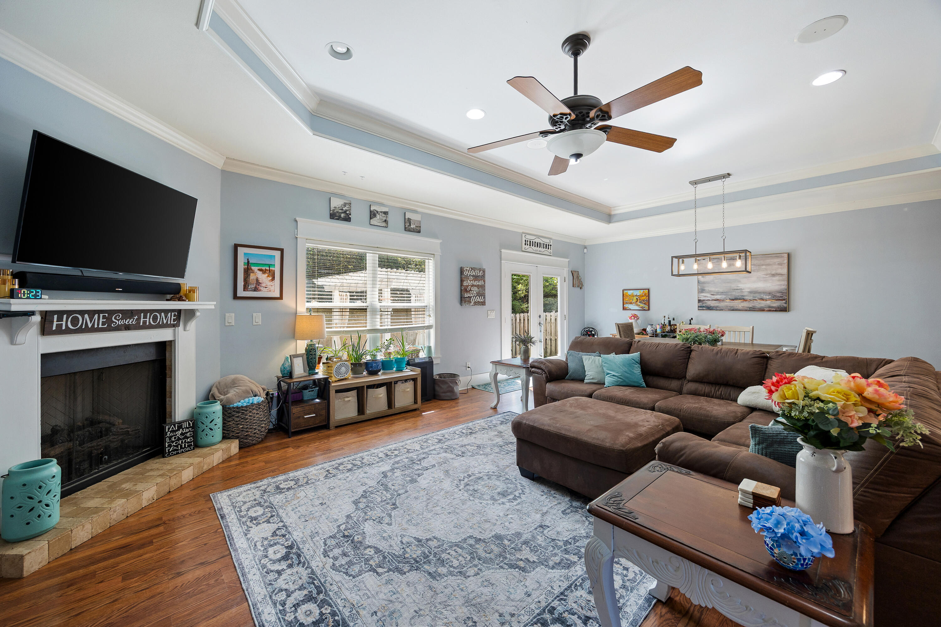 804 Symphony Way Freeport, FL 32439 - Photo 5 of 34 a living room with furniture and a flat screen tv