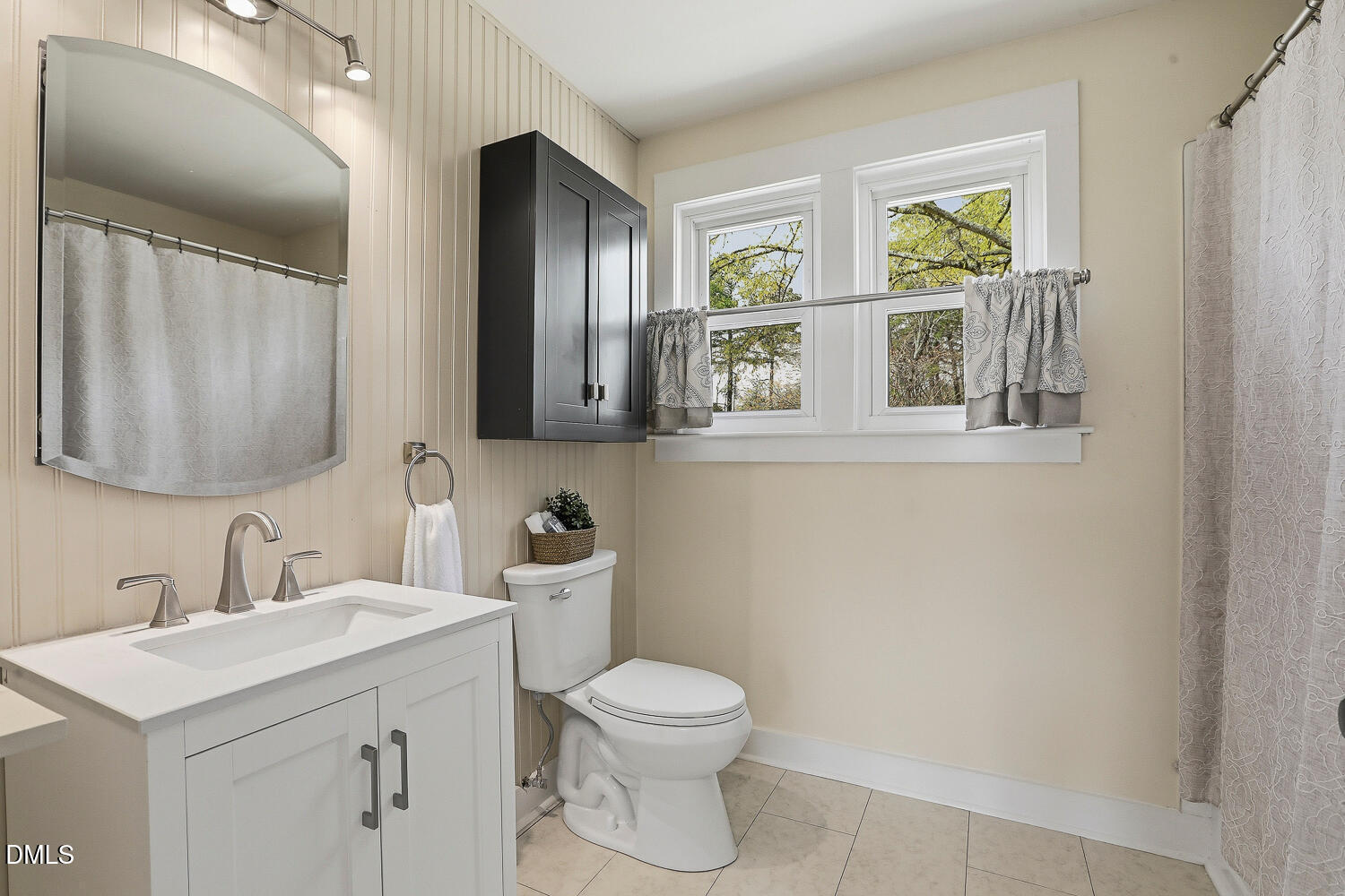 6023 Sentinel Drive Raleigh, NC 27609 - Photo 33 of 53 a bathroom with a toilet sink and mirror