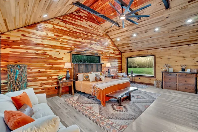 a backyard of a house with barbeque oven table and chairs