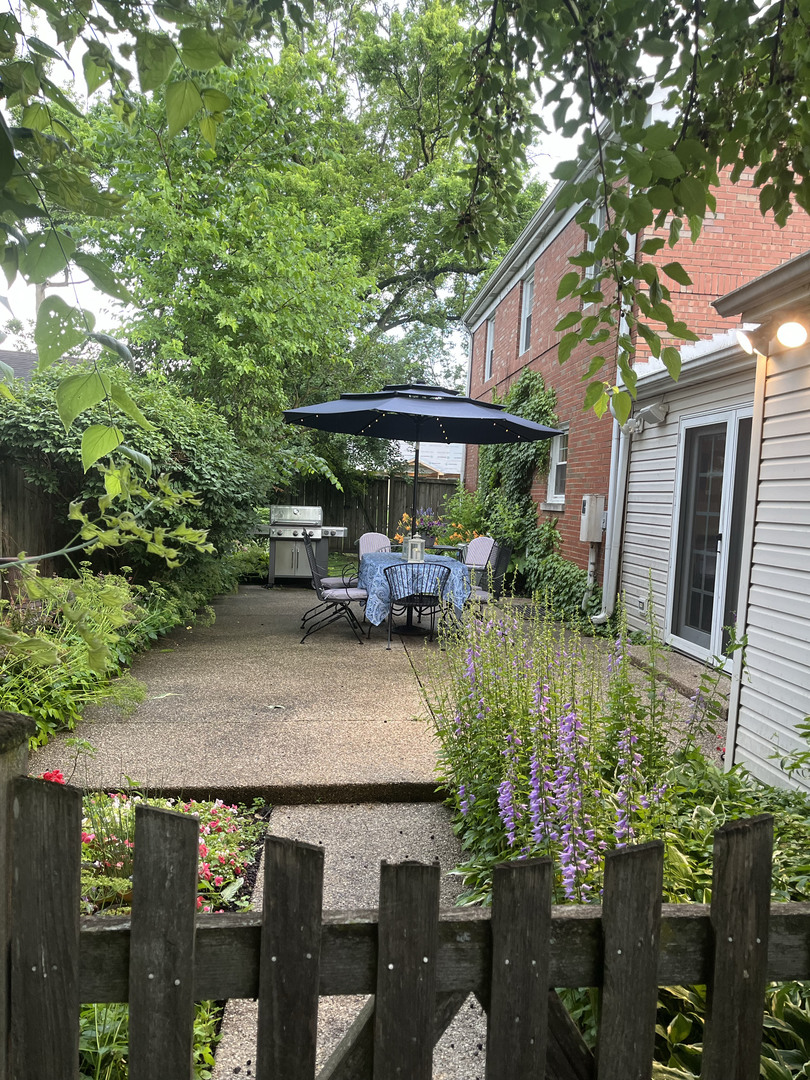 2430 Covert Road Glenview, IL 60025 - Photo 19 of 26 a backyard of a house with yard barbeque oven and outdoor seating