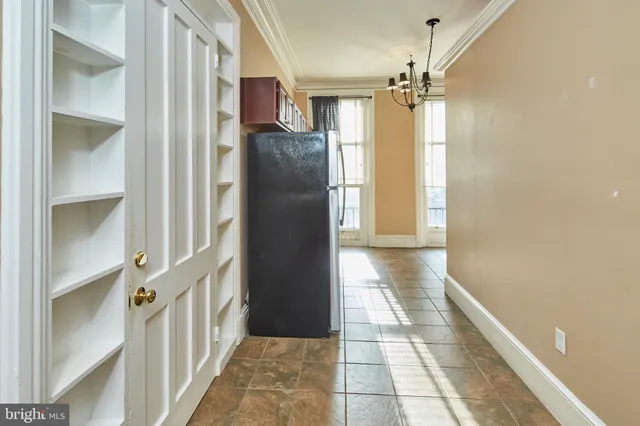 a bathroom with a glass shower door and mirror