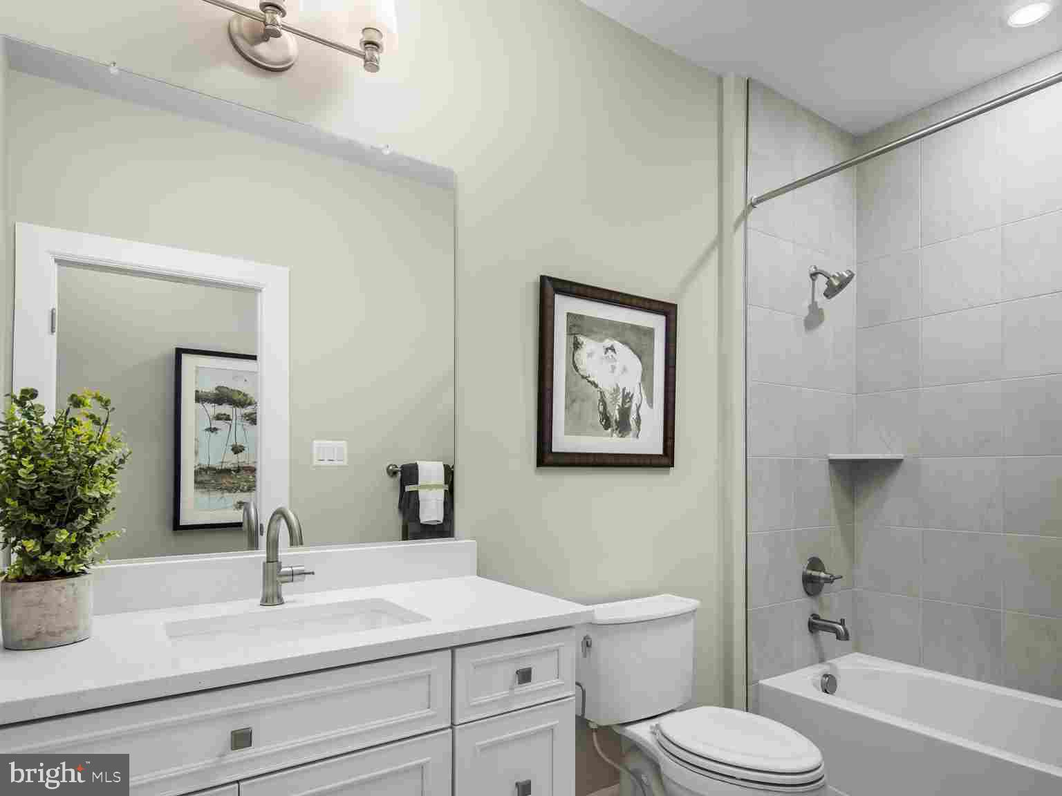 6558 Stream Song Court Columbia, MD 21044 - Photo 16 of 20 a bathroom with a sink a toilet and shower