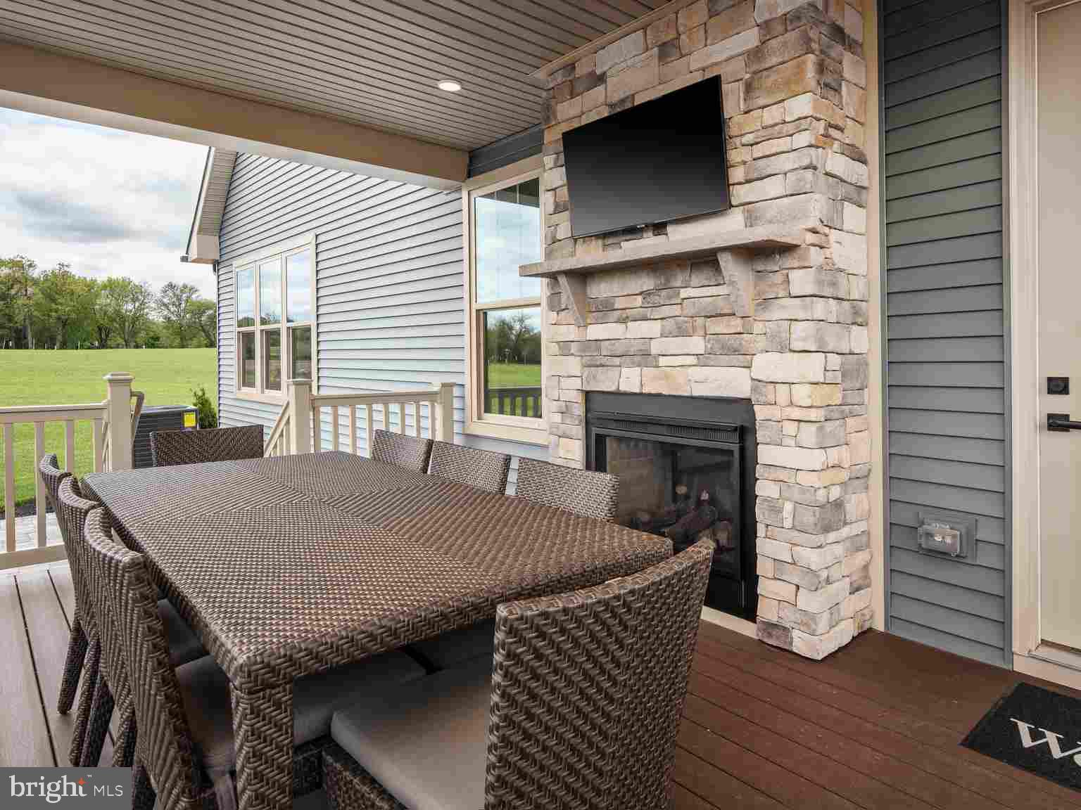 6558 Stream Song Court Columbia, MD 21044 - Photo 20 of 20 a view of a patio with table and chairs a barbeque with wooden floor and fence