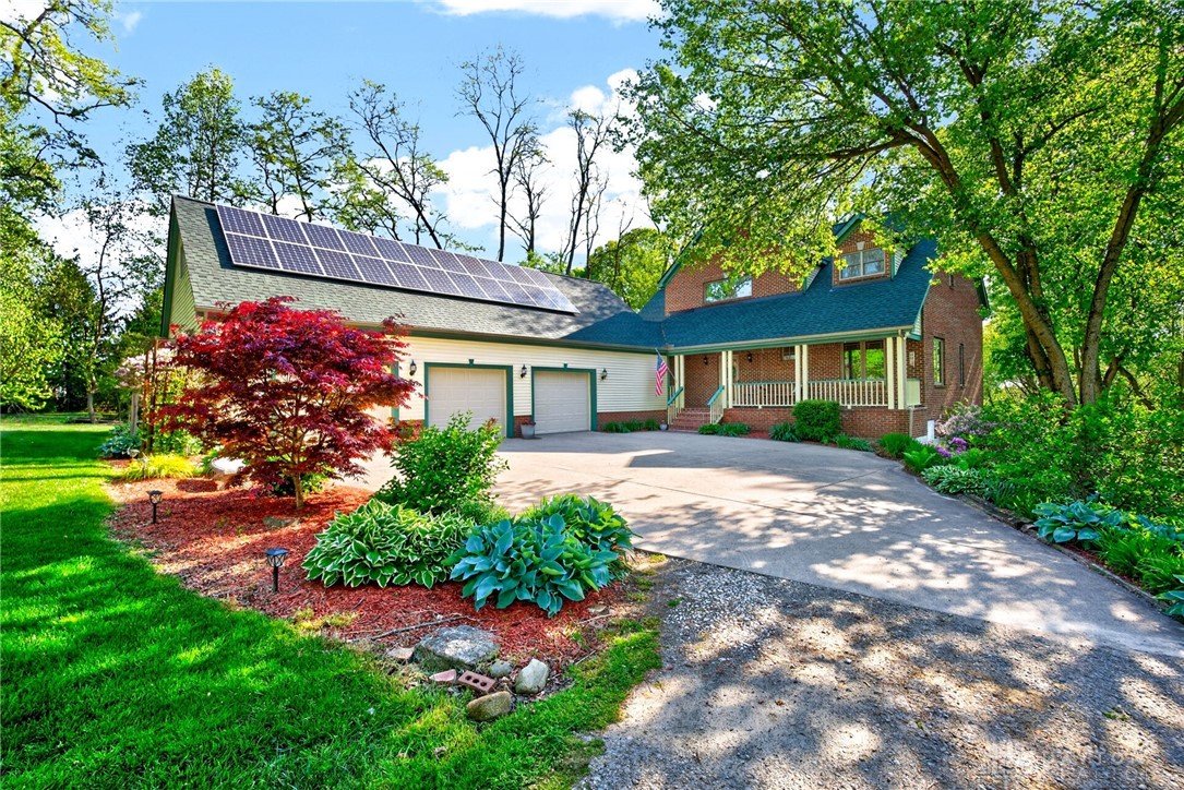 330 South Alpha Bellbrook Road Bellbrook, OH 45305 - Photo 2 of 87 This charming home offers ample parking and lush landscaping, complemented by modern solar panels.