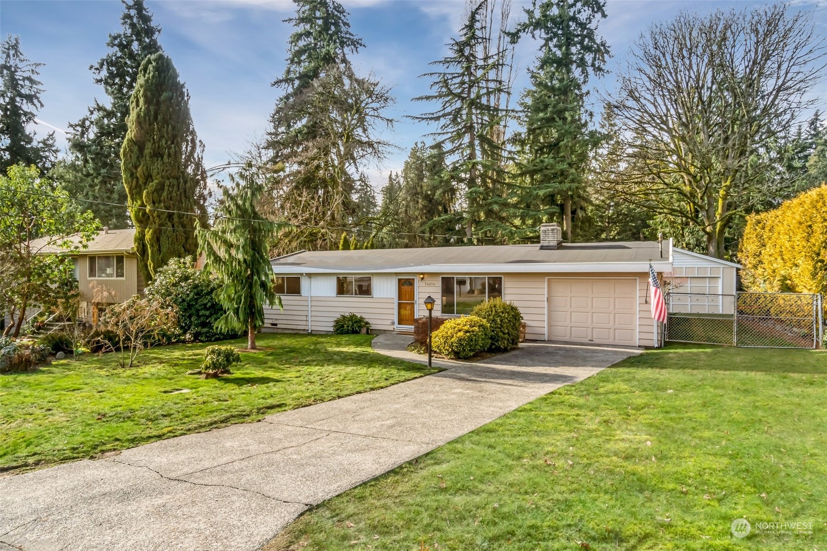 24204 2nd Place West Bothell, WA 98021 - Photo 1 of 34 a front view of a house with a yard and garage